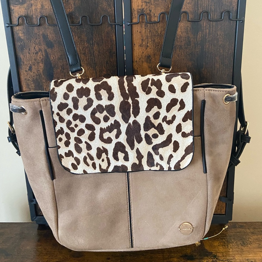 Tan backpack with animal print detail